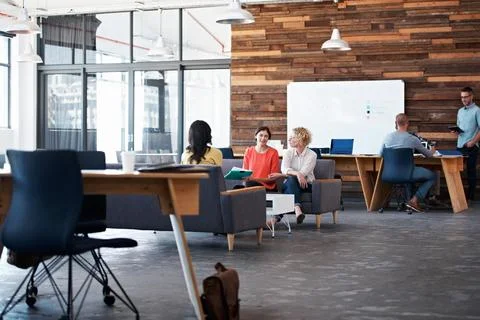 Creative, people and conversation in office with meeting, data report and plan Stock Photos