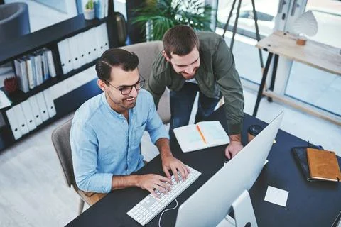 Creative, people and typing with computer in office for internship, technical Stock Photos