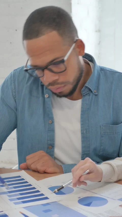 Creative People Doing Paperwork in Office, vertical video Vídeo Stock 325696195