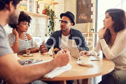Creative people meeting at a cafe Stock Photos