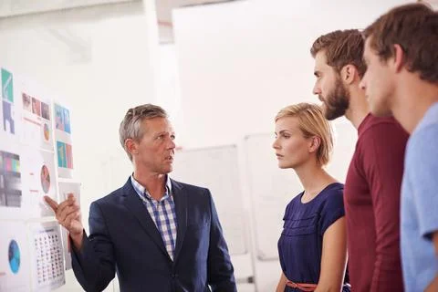 Creative people, presentation and planning with team on glass board for pro.. Stock Photos