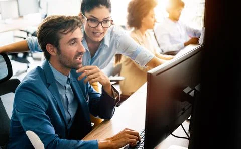 Creative people working in office on computer Stock Photos