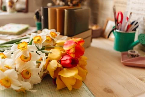 A creative person makes a scrapbook or notebook in their office. Handmade Stock Photos