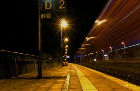 Creative perspective on a railstation in the night Stock Photos