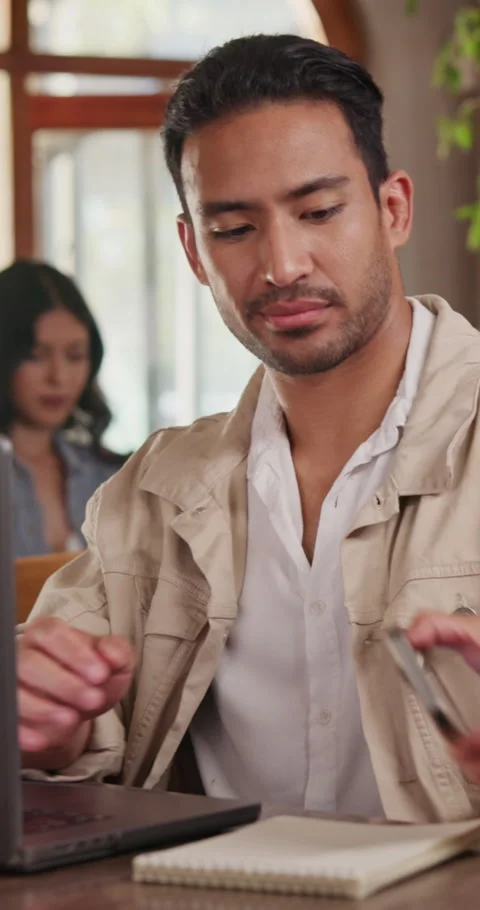 Creative, phone call and man with laptop in restaurant, remote work or Stock Footage 340611165