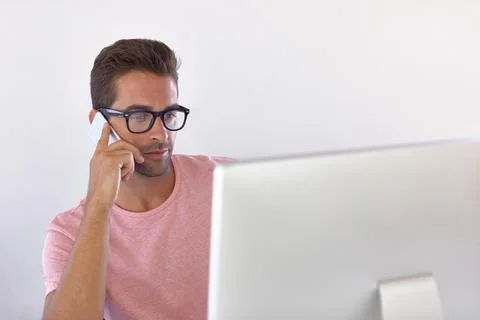Creative, phone call and man in agency with computer, ads feedback and web .. Stock Photos
