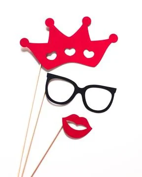 Creative photo props featuring a crown, glasses, and lips for fun parties and Stock Photos