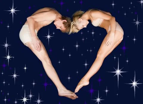 Creative photo of two dates lying over starry background in the form of heart Fotos Stock