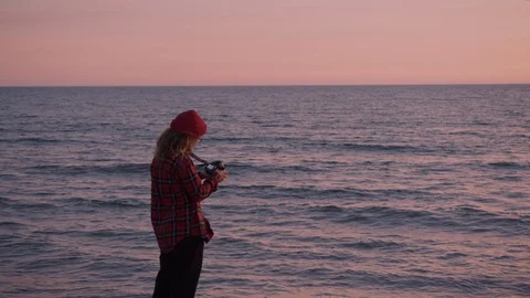 Creative photographer freelancer woman at beach Stock Footage 102041663