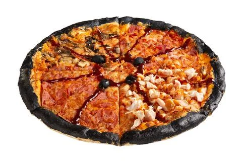 Creative pizza with black edges, four types of filling and barbecue sauce. Stock Photos