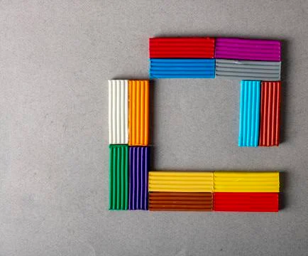Creative plasticine concept, flat lay. Plasticine sticks with corners Stock Photos