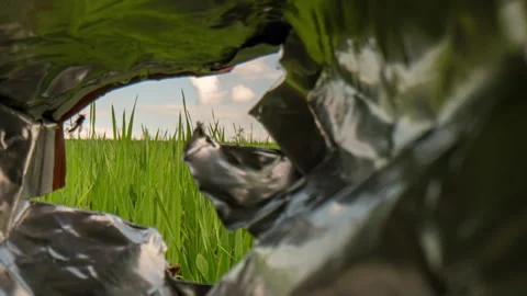 Creative point of view shot moving through a plastic bag toward a bright... Stock Footage 342730595