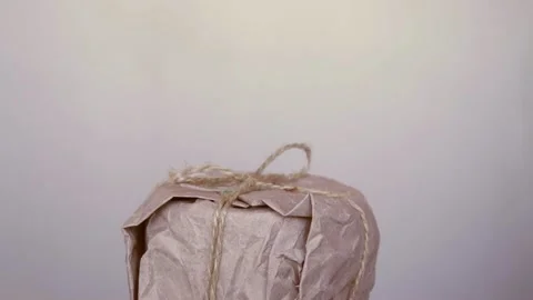 Creative present in reusable eco friendly organic materials gift wrapping Stockbeeldmateriaal 165407347