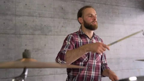 Creative Process. Attractive Man Playing Drums In The Rehearsal Space Alone Video stock 155554589