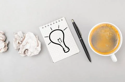 Creative process creative process. crumpled wads, notebook with bulb pictu... 库存照片
