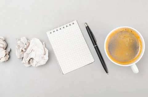 Creative process creative process. crumpled wads, blank notebook and cup C... Stockfoto's