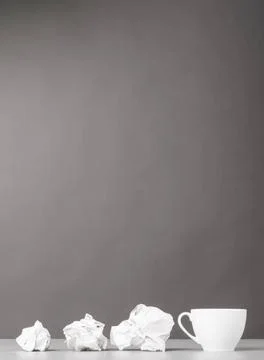 Creative process creative process. crumpled wads and cup on gray Copyright... 스톡 사진