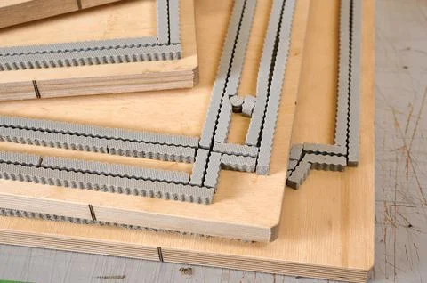 Creative process of die cutting dies for producing unique cardboard boxes in a Stock Photos
