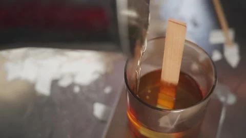 The creative process of making aromatic wax candles. A woman pours melted wax Vidéo 269494682