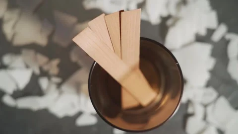 The creative process of making wax scented candles. There is a glass with wooden Vídeo Stock 269406437