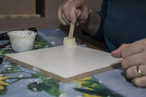 Creative process of painting on a blank canvas in a cozy workspace Stock Photos