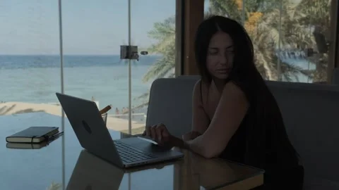 Creative professional pausing during laptop work to think through an idea in Stock Footage 346251017