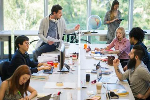 Creative professionals using shared office space Stock Photos