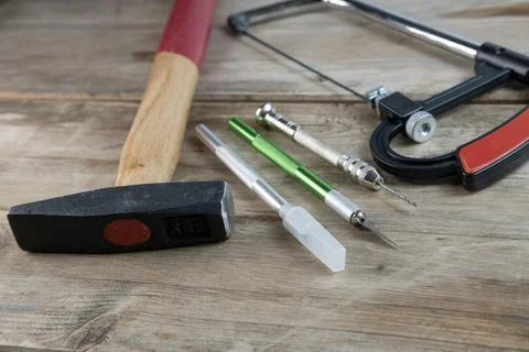 Creative project crafting hand tools jigsaw, knife and drill arranged on wo.. Stock Photos