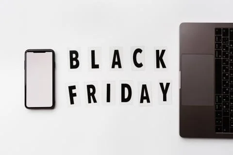 Creative promotion composition Black friday text and laptop on white backgrou Stock Photos