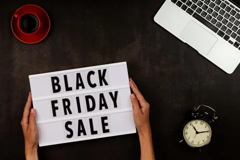 Creative promotion composition for Black friday with laptop on black background Stock Photos