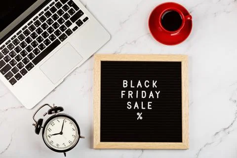 Creative promotion composition for Black friday with laptop on white background Stock Photos