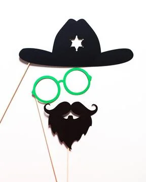 Creative props for fun photo sessions featuring a cowboy hat, glasses, and a Stock Photos