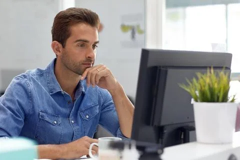 Creative, reading and man with computer in business, typography or graphic .. Stock Photos