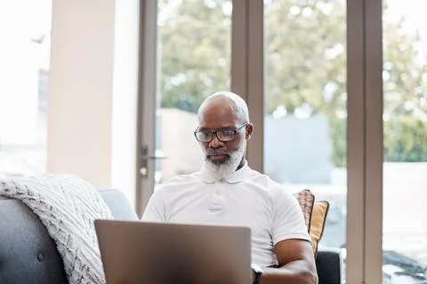 Creative, remote work and man with laptop in lounge, email marketing or res.. Stock Photos