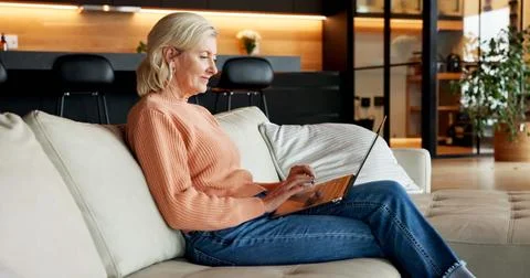 Creative, remote work and woman with laptop in lounge, smile and proofreadi.. Stock Photos