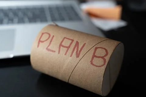 A creative representation of the concept PLAN B written in red on a brown paper Stock Photos