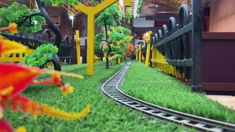 Creative Restaurant Interior Featuring Miniature Railway Track And Scenic T.. Stock Footage 339477394
