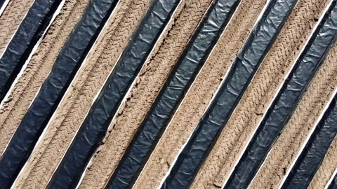 Creative rotating tracks in field Stock Footage 150974973