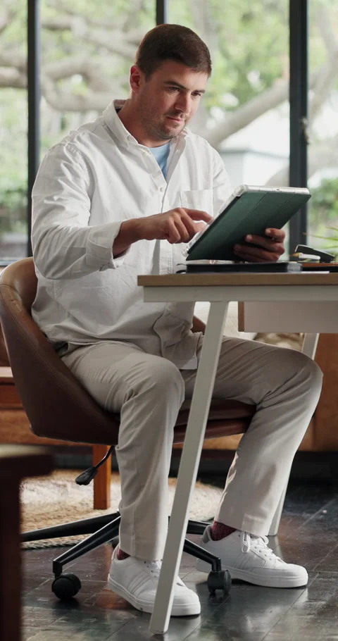 Creative, scroll and man in home, tablet for online submission and ideas for Stock Footage 330909664