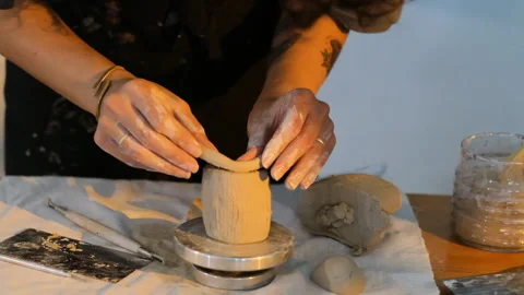 Creative sculptor working with clay and modeling tools  for a ceramic sculpture Stock Footage 344645884