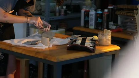 Creative sculptor working with clay and modeling tools  for a ceramic sculpture Stock Footage 344647940