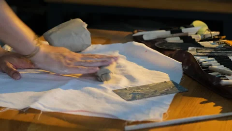 Creative sculptor working with clay and modeling tools  for a ceramic sculpture Stock Footage 344649717