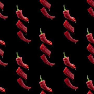 Creative seamless background with flying red bitter pepper. 写真素材