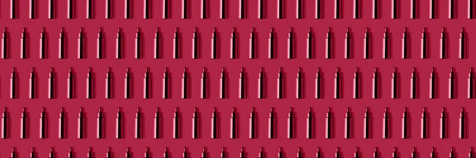Creative seamless pattern of cosmetic tubes toned in trendy magenta color of Stock Photos