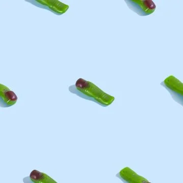 Creative seamless pattern with jelly finger zombie on light blue background.  Stock Photos