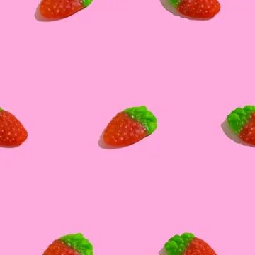 Creative seamless pattern with jelly raspberry on pink background. Candy abst Stock Photos