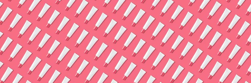 Creative seamless pattern of pink and white cosmetic tubes on white background. Stock Illustration