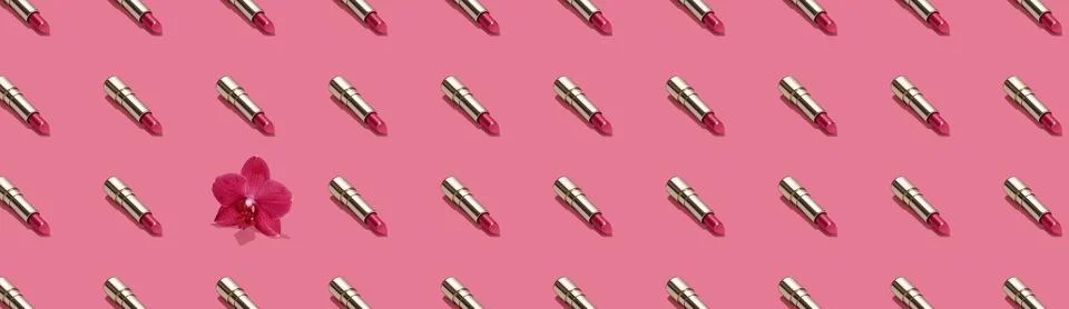 Creative seamless pattern of vivid pink golden lipsticks and orchid flower on Stock Photos