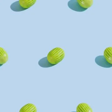 Creative seamless pattern with watermelon candy on light blue background. Can Foto stock