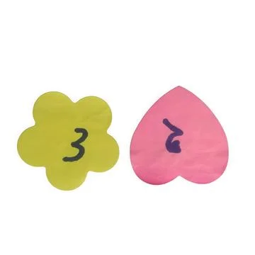 A creative set featuring a green flower shape and a pink heart shape, each .. Stock Illustration